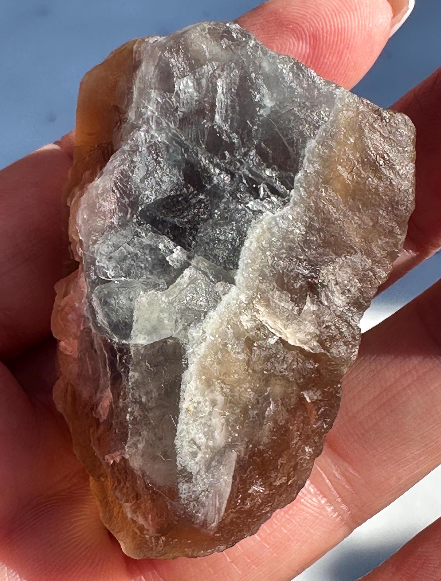 79 Grams Beautifu Natural Transparency Brownish Flourite with Baby Blue Phantom from China