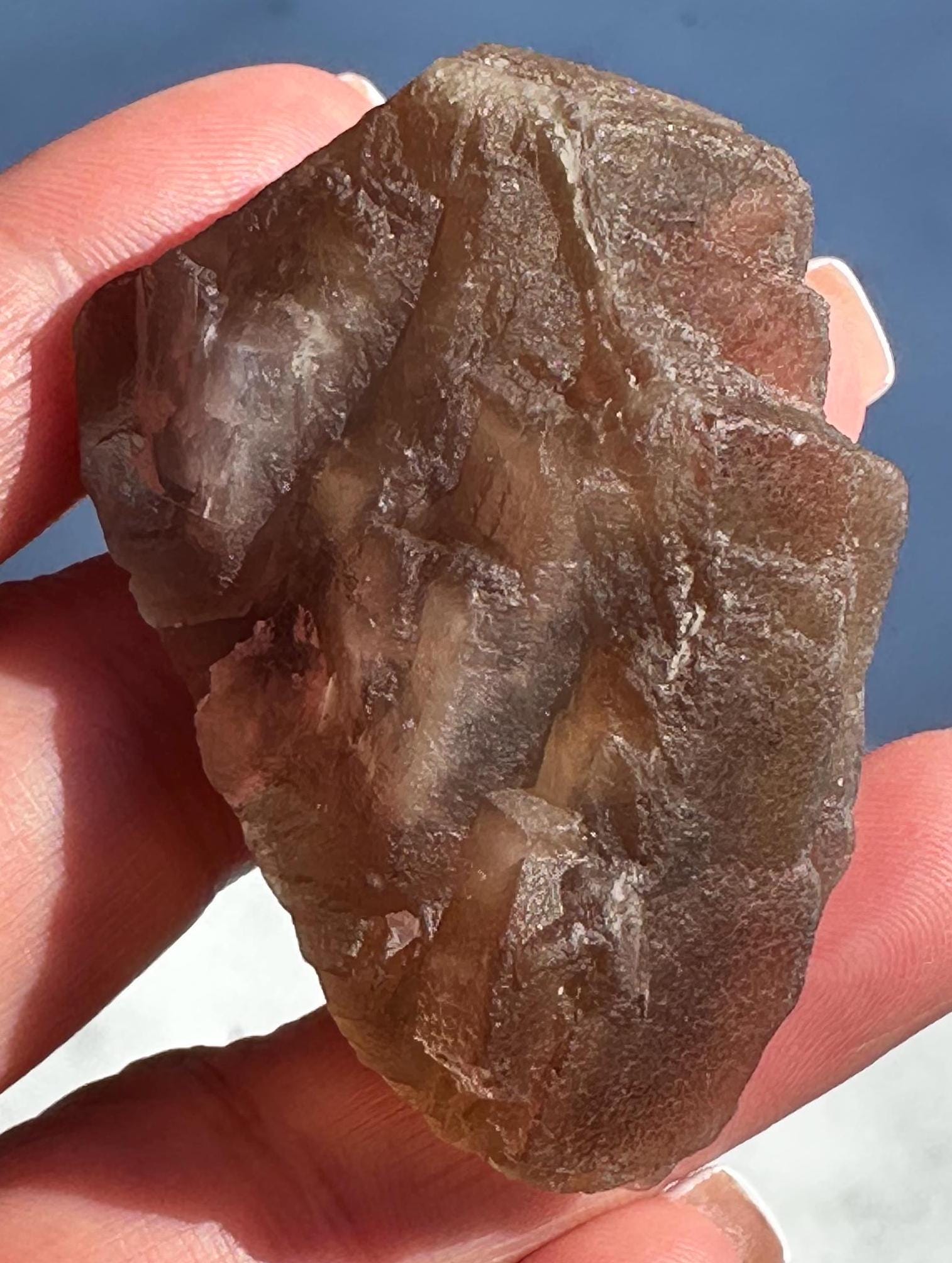 79 Grams Beautifu Natural Transparency Brownish Flourite with Baby Blue Phantom from China