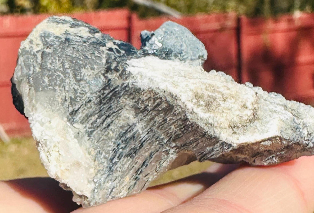 50 Grams of Blue / Black Riebeckite included Quartz From Pakistan